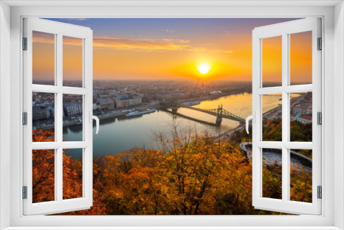 Fototapeta Naklejka Na Ścianę Okno 3D - Budapest, Hungary - Panoramic skyline view of Budapest at sunrise with beautiful autumn foliage, Liberty Bridge (Szabadsag Hid) and lookout on Gellert Hill