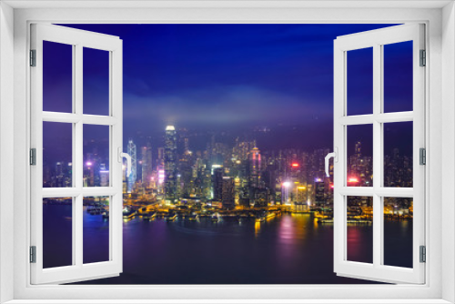 Fototapeta Naklejka Na Ścianę Okno 3D - Aerial view of illuminated Hong Kong skyline. Hong Kong, China