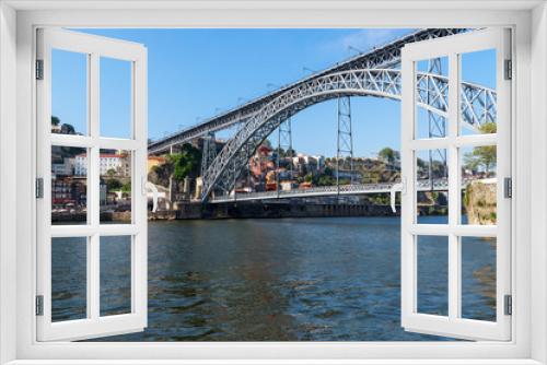 Fototapeta Naklejka Na Ścianę Okno 3D - Scenic view of the bridge Dom Luis I Bridge from Vila Nova de Gaia. The river Douro, Porto, Portugal on the summer sunny day.