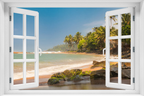 Fototapeta Naklejka Na Ścianę Okno 3D - Paradise Mirissa beach in Sri Lanka. Yellow sand and palm trees with blue sky.