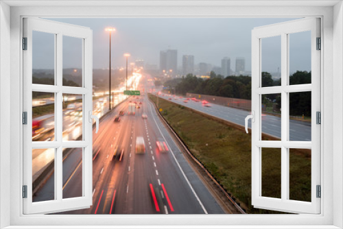 Fototapeta Naklejka Na Ścianę Okno 3D - View of highway 401 in Toronto, Canada with the bridge on rainy day