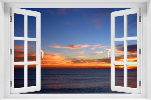 Fototapeta Naklejka Na Ścianę Okno 3D - sunset over the sea,sky,clouds,view,calm,sunrise,nature,orange,blue,light,sunlight