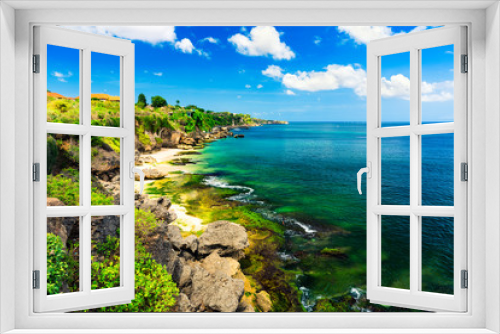 Fototapeta Naklejka Na Ścianę Okno 3D - Azure beach with rocky mountains and clear water of Indian ocean at sunny day / A view of a cliff in Bali Indonesia / Bali, Indonesia
