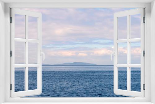 Summer afternoon view from the sea to the islands of the Body (Kuzova archipelago) in the White Sea