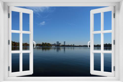 Fototapeta Naklejka Na Ścianę Okno 3D - Lake and blue sky cityscape