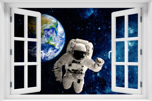Fototapeta Naklejka Na Ścianę Okno 3D - astronaut flies over the earth in space. 