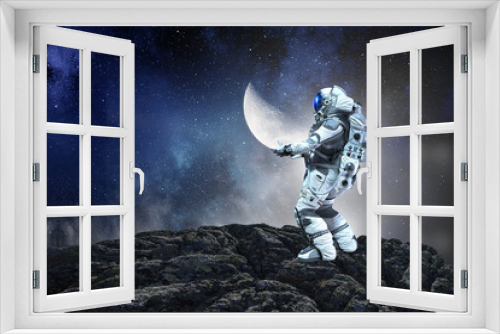 Fototapeta Naklejka Na Ścianę Okno 3D - Spaceman carry moon planet. Mixed media
