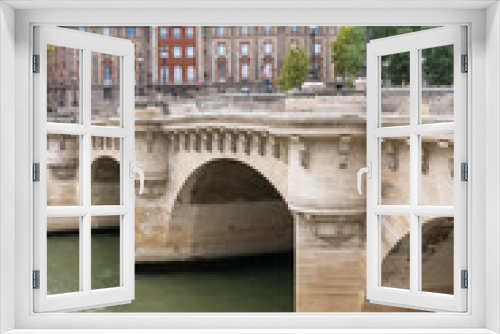 Paris, panorama of the Pont-Neuf, with typical buildings in background quai de Conti 
