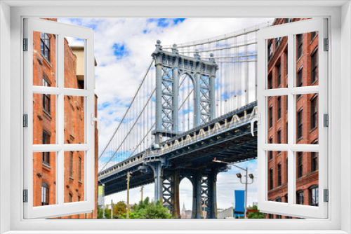 Fototapeta Naklejka Na Ścianę Okno 3D - DUMBO district in Brooklyn. NEW YORK, USA. Dumbo is a neighborhood in the New York City borough of Brooklyn. Red buildings and Manhattan Bridge..