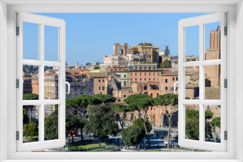 Fototapeta Naklejka Na Ścianę Okno 3D - View of the Roman Forum and the city of Rome from Palatine Hill. The forum with its adjoining buildings is located in the center of ancient Rome. Temples, arches, basilicas and other buildings. 