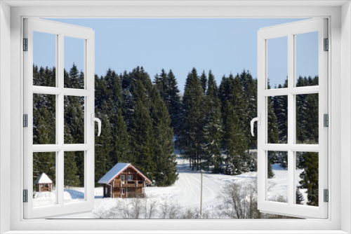 Fototapeta Naklejka Na Ścianę Okno 3D - Winter landscape with a wooden house on the edge of the forest
