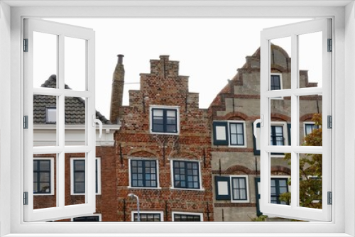 Fototapeta Naklejka Na Ścianę Okno 3D - Typische alte holländische Hausfassaden und Dächer