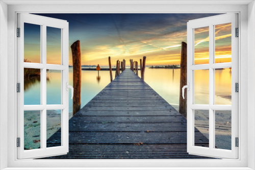Fototapeta Naklejka Na Ścianę Okno 3D - Architecture built walkway on the water with perspective, view art and calm water at sunny sunset