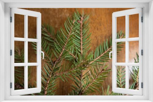 Fototapeta Naklejka Na Ścianę Okno 3D - Prickly green branches of spruce on wooden table