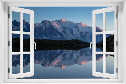 Fototapeta Naklejka Na Ścianę Okno 3D - The Mont Blanc massif reflected in Lac de Chesery during dusk. Chamonix, France.
