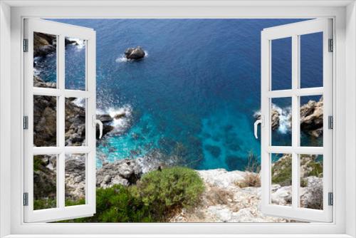 Fototapeta Naklejka Na Ścianę Okno 3D - Beautiful seascape with turquoise water, cliffs and the sea. Sunny warm tropical day. Background for travel on the Mediterranean. Greece. Europe