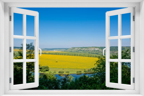 Fototapeta Naklejka Na Ścianę Okno 3D - Beautiful view of nature. Blue sky, yelow field.