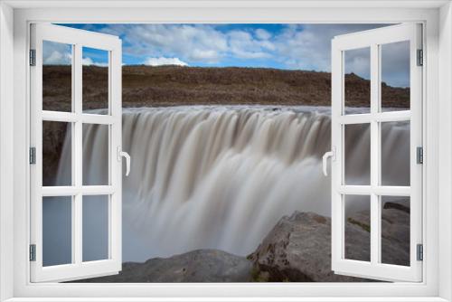 Fototapeta Naklejka Na Ścianę Okno 3D - Dettifoss is waterfall in Vatnajökull National Park in Northeast Iceland, and is reputed to be the most powerful waterfall in Europe. The water comes from the nearby Vatnajökull glacier