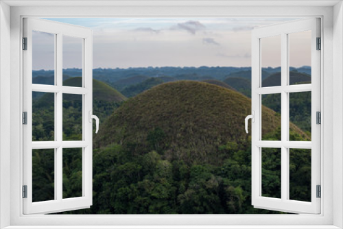 Fototapeta Naklejka Na Ścianę Okno 3D - Chocolate hills, geological formation in the Bohol island, Philippines. They are covered in green grass that turns brown (like chocolate) during the dry season. November, 2018