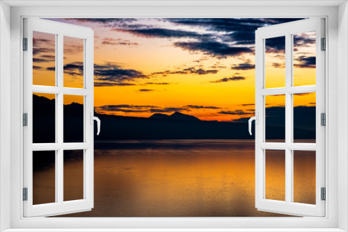 Fototapeta Naklejka Na Ścianę Okno 3D - Beautiful colorful sunset in the autumn above the French Alps and  Lake Geneva where the colors and clouds reflect beautifully.