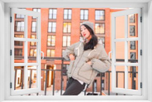 fashion outdoor photo of gorgeous sensual woman with black hair in elegant clothes  walking by winter city