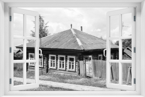 Fototapeta Naklejka Na Ścianę Okno 3D - Old log house in the village
