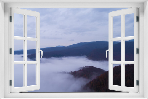 Fototapeta Naklejka Na Ścianę Okno 3D - Foggy forest and natural cloud landscape photo.Aerial shot.