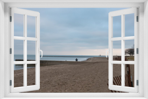 Fototapeta Naklejka Na Ścianę Okno 3D - Lonely person on beach at sunset