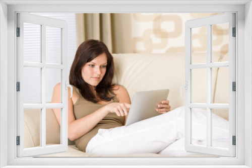 Young woman with touch screen tablet computer