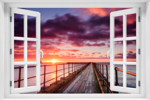Fototapeta Naklejka Na Ścianę Okno 3D - Sunrise at River Blyth Harbour, as the river reaches the North Sea between the piers in Northumberland