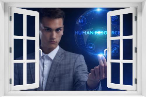 The concept of business, technology, the Internet and the network. A young entrepreneur working on a virtual screen of the future and sees the inscription: Human resources