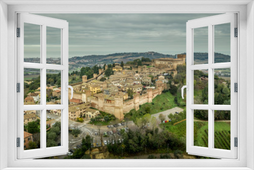 Fototapeta Naklejka Na Ścianę Okno 3D - Aerial view of the walled town and castle of Gradara in Marche Italy popular tourist destination of the well preserved double walls and castle