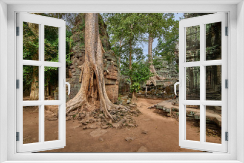 Fototapeta Naklejka Na Ścianę Okno 3D - Trees raised on the ruins of the temple Ta Prohm,temple at Angkor Wat complex, Angkor Wat Archaeological Park in Siem Reap, Cambodia UNESCO World Heritage Site