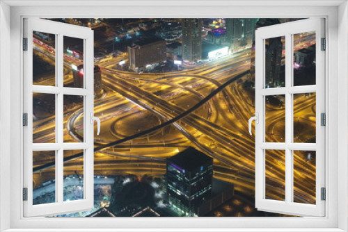 Fototapeta Naklejka Na Ścianę Okno 3D - Aerial view of highway junction in Dubai, UAE. View from the height of Burj Khalifa timelapse