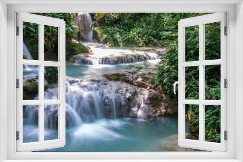 Fototapeta Naklejka Na Ścianę Okno 3D - Beautiful stream waterfalls cascade over pretty green moss covered stones