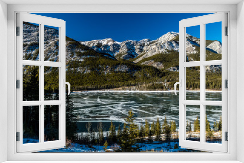 Fototapeta Naklejka Na Ścianę Okno 3D - A sheen of ice still covers Barrier Lake, Bow Valley Provincial Park, Alberta, Canada