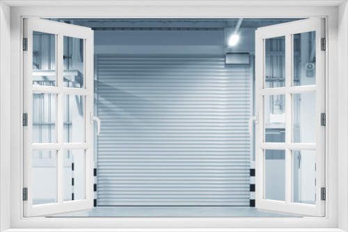Fototapeta Naklejka Na Ścianę Okno 3D - Roller door or roller shutter. Also called security door or security shutter with automatic system. For protection industrial building i.e. factory, warehouse, hangar, workshop, store, hall or garage.