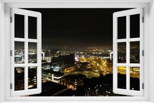 Fototapeta Naklejka Na Ścianę Okno 3D - Aerial night time photo taken above the Leeds City Center at Christmas Time showing the Leeds Town Hall and buildings and roads around West Yorkshire.
