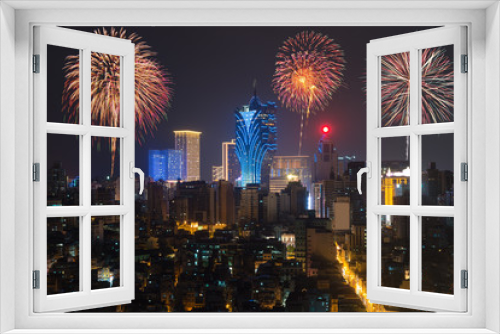 Fototapeta Naklejka Na Ścianę Okno 3D - New Year’s fireworks at Macau (Macao), China. Skyscraper hotel and casino building at downtown in Macau (Macao).