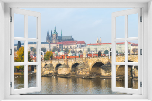 prague river bank and old town at background, czech republic