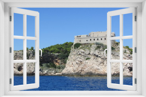 Fototapeta Naklejka Na Ścianę Okno 3D - View to Dubrovnik city wall tower from the water, Croatia