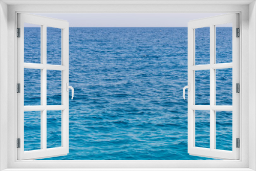 Fototapeta Naklejka Na Ścianę Okno 3D - Blue sea background. Beautiful sky and blue ocean or sea. Blue sea surface with waves
