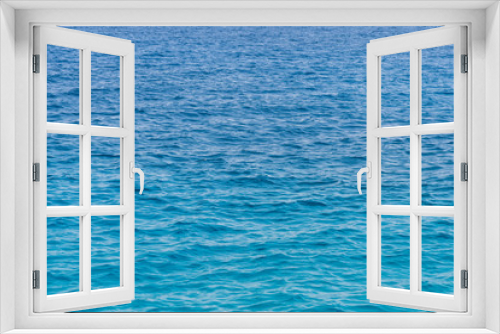 Fototapeta Naklejka Na Ścianę Okno 3D - Blue sea background. Blue sea surface with waves