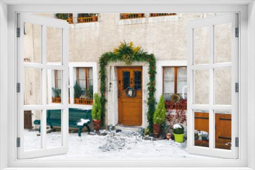 Fototapeta Naklejka Na Ścianę Okno 3D - Building door in Gruyeres town village winter