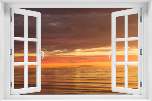Fototapeta Naklejka Na Ścianę Okno 3D - Red Sunset Over the Sea, Rich In Dark Clouds, Rays Of Light. Morning Glory In Heaven