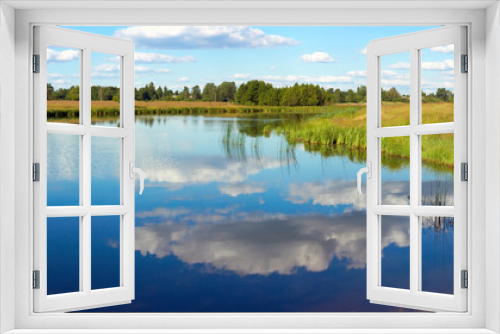 Fototapeta Naklejka Na Ścianę Okno 3D - Summer rushy lake panorama