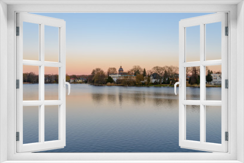Fototapeta Naklejka Na Ścianę Okno 3D - Scenery of Heiliger see, the lake in Potsdam, Germany and waterside in winter during sunset twilight time and sky.