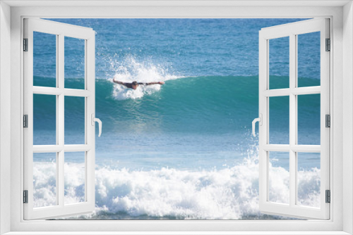 Fototapeta Naklejka Na Ścianę Okno 3D - man surfer in the ocean catches the wave