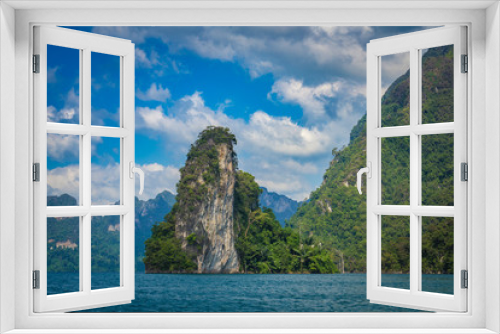 Fototapeta Naklejka Na Ścianę Okno 3D - Panoramic view to landscape with mountains and Cheow lan lake natural attractions in Khao Sok National Park, Surat Thani Province, Thailand.