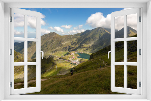 Fototapeta Naklejka Na Ścianę Okno 3D - Girl hiking through Fagaras mountains in Romania.